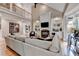 Open living space with a fireplace, built-in shelving units, and hardwood floors at 8070 Georgetown Cir, Suwanee, GA 30024