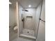 Modern bathroom featuring a glass-enclosed shower with sleek black fixtures and attractive marble tiling at 2022 Detroit Ave, Atlanta, GA 30314