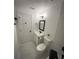 Cozy bathroom featuring a toilet, a sink with a mirror, a towel rack and a walk-in shower at 2022 Detroit Ave, Atlanta, GA 30314