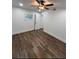 Bright bedroom featuring hardwood floors, a ceiling fan, and neutral colors at 2022 Detroit Ave, Atlanta, GA 30314