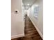 Hallway with modern flooring, white walls, recessed lighting, and plenty of storage space at 2022 Detroit Ave, Atlanta, GA 30314
