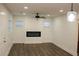 Bright living room with dark wood floors, a modern fireplace, and recessed lighting at 2022 Detroit Ave, Atlanta, GA 30314