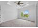 Bright bedroom with large window offering a scenic view at 5395 Lacosta Ln, Alpharetta, GA 30022