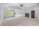 Large bedroom with a tray ceiling, carpet, and lots of natural light from multiple windows at 5395 Lacosta Ln, Alpharetta, GA 30022