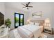 Stylishly furnished bedroom with modern decor, balcony access, and carpet at 5395 Lacosta Ln, Alpharetta, GA 30022