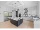Contemporary kitchen featuring custom cabinets, quartz countertops, stainless steel appliances, and a large island with seating at 5395 Lacosta Ln, Alpharetta, GA 30022