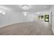 Large entertainment area with recessed lighting and outdoor access at 5395 Lacosta Ln, Alpharetta, GA 30022