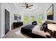 Stunning main bedroom with tray ceiling, modern decor, and abundant natural light at 5395 Lacosta Ln, Alpharetta, GA 30022