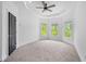 Spacious bedroom featuring tray ceilings, carpet floors, and lots of natural light at 5395 Lacosta Ln, Alpharetta, GA 30022