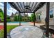 Relaxing backyard with swimming pool, patio, pergola and lush landscaping at 5395 Lacosta Ln, Alpharetta, GA 30022