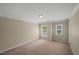 Bedroom with neutral walls, bright windows and carpet at 5510 Weddington Dr, Cumming, GA 30040
