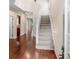 Inviting foyer with hardwood floors and staircase, providing an elegant entrance to the home at 5510 Weddington Dr, Cumming, GA 30040