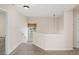 Hallway features carpet, neutral walls and a modern hanging light at 5510 Weddington Dr, Cumming, GA 30040