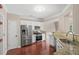 Spacious kitchen with stainless steel appliances, granite countertops, white cabinetry and lots of natural light at 5510 Weddington Dr, Cumming, GA 30040