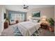 Serene main bedroom with large windows, plush bedding, and elegant decor for a peaceful retreat at 5510 Weddington Dr, Cumming, GA 30040