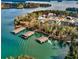Stunning aerial view of lakefront community, showcasing private docks, mature trees, and waterfront homes at 4435 Pebble Rock Dr, Cumming, GA 30041