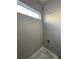 Bathroom featuring tub with tiled walls and window at 4435 Pebble Rock Dr, Cumming, GA 30041