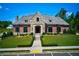 Beautiful clubhouse featuring stone and brick exterior and manicured landscaping at 4435 Pebble Rock Dr, Cumming, GA 30041
