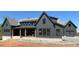 New construction exterior elevation showing board and batten siding and dark trim at 4435 Pebble Rock Dr, Cumming, GA 30041