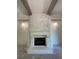 Fireplace with stone surround and wood mantel at 4435 Pebble Rock Dr, Cumming, GA 30041