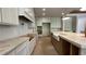 Bright kitchen with custom cabinets, stone countertops and a farmhouse sink at 4435 Pebble Rock Dr, Cumming, GA 30041