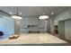 Spacious kitchen featuring a large island with light countertops and custom cabinetry at 4435 Pebble Rock Dr, Cumming, GA 30041