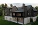 Elegant home rear exterior featuring covered porch and stone foundation at 4435 Pebble Rock Dr, Cumming, GA 30041