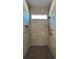 Modern shower with bright gray tile and bench at 4435 Pebble Rock Dr, Cumming, GA 30041