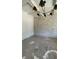 Study featuring modern chandelier and stone accent wall at 4435 Pebble Rock Dr, Cumming, GA 30041