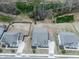 Aerial view of homes, showcasing landscaping, spacious lots, and an overview of the neighborhood layout at 449 Carmichael Cir, Canton, GA 30115