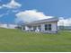 The back of the home reveals a large, manicured lawn, perfect for outdoor activities at 449 Carmichael Cir, Canton, GA 30115