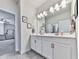 Bright bathroom with double sinks, vanity, and neutral color palette at 449 Carmichael Cir, Canton, GA 30115