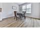 Cozy dining area with a round table, modern chairs, and a window that provides ample natural light at 449 Carmichael Cir, Canton, GA 30115