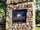 Stone entrance sign that reads 'Carmichael Farms' with a horse image for a warm welcome to the community at 449 Carmichael Cir, Canton, GA 30115