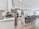 Bright kitchen with stainless steel appliances, large island with seating and modern pendant lighting at 449 Carmichael Cir, Canton, GA 30115