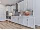 Modern kitchen with white cabinets, stainless steel appliances, and gray subway tile backsplash at 449 Carmichael Cir, Canton, GA 30115