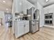 Bright kitchen featuring modern stainless steel appliances, and white cabinets and countertops at 449 Carmichael Cir, Canton, GA 30115