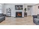 Cozy living room with fireplace, shelving, and built-in beverage cooler near comfortable seating at 449 Carmichael Cir, Canton, GA 30115
