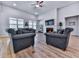 Bright and airy living room with fireplace, ceiling fan, and comfortable seating arrangement at 449 Carmichael Cir, Canton, GA 30115