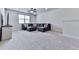 Spacious living room with plush carpeting, perfect for relaxation and entertainment with a window for natural light at 449 Carmichael Cir, Canton, GA 30115