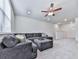 Comfortable living room featuring plush seating, neutral tones, and natural light with a ceiling fan at 449 Carmichael Cir, Canton, GA 30115