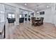 Open-concept living area boasts a fireplace, hardwood floors, and ample seating at 449 Carmichael Cir, Canton, GA 30115