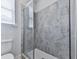 Shower with neutral large-format tiling and glass door at 449 Carmichael Cir, Canton, GA 30115