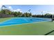 Brightly colored community tennis court ready for play, with green surroundings and quality net at 449 Carmichael Cir, Canton, GA 30115