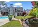 Backyard featuring a koi pond, pool, hot tub, and meticulous landscaping at 904 Beaumont Ct, Canton, GA 30114
