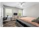 Well-lit bedroom with wood floors, contemporary furnishings, and bright natural light at 904 Beaumont Ct, Canton, GA 30114