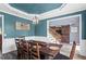 Dining room with blue walls and a wood table at 904 Beaumont Ct, Canton, GA 30114