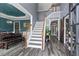 Bright foyer with staircase, wood floors, and view into the dining room at 904 Beaumont Ct, Canton, GA 30114