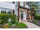 Inviting front porch with wood columns and hanging plants at 904 Beaumont Ct, Canton, GA 30114