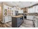 Modern kitchen with stainless steel appliances, granite countertops, and a center island at 904 Beaumont Ct, Canton, GA 30114